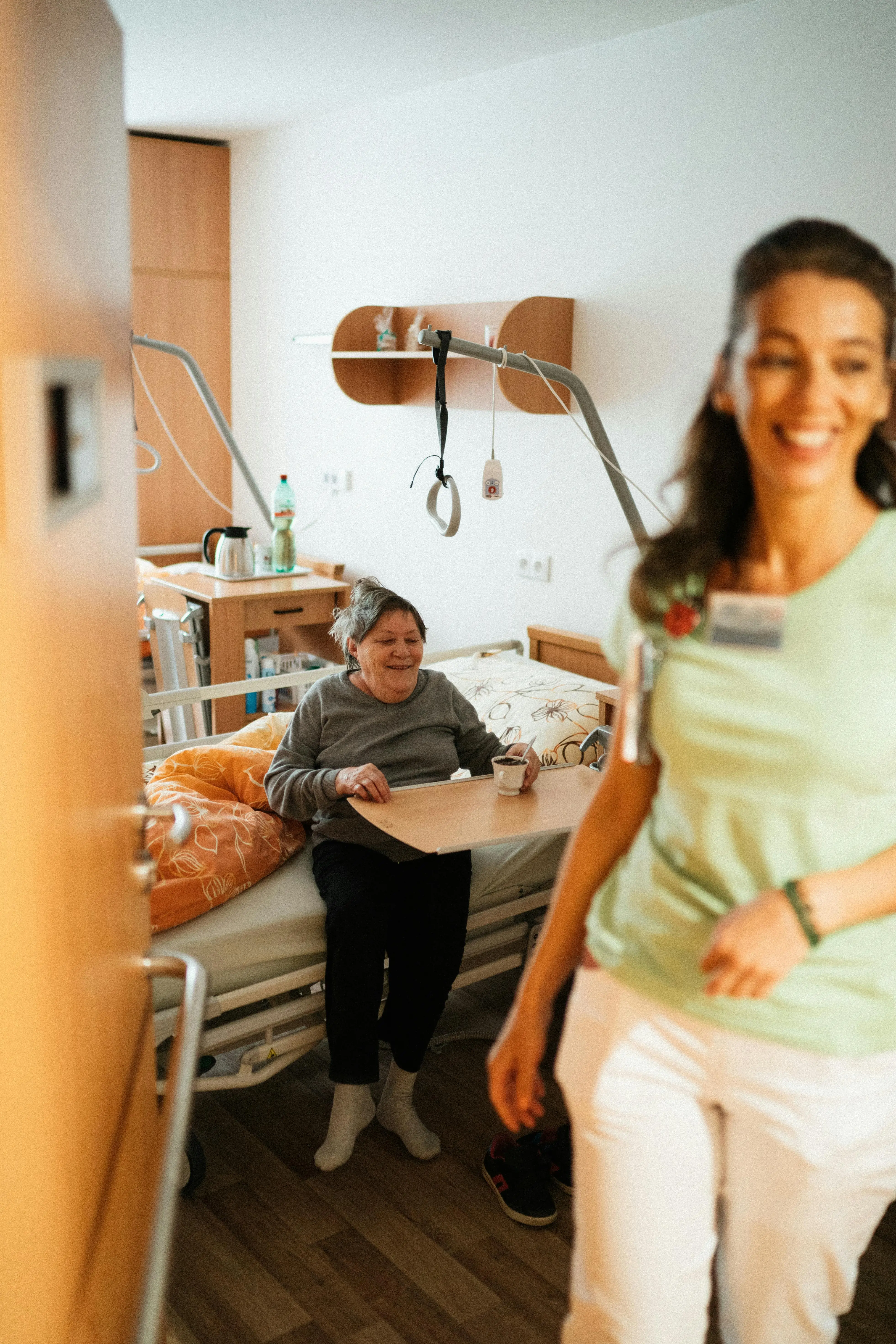 Caring nurse with senior patient